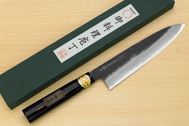 Sakai Genkichi Kurouchi Warikomi White steel 2 Gyuto knife 210mm (8.2") Magnolia Wood with Akebono-Nuri Urushi Lacque Sakai Genkichi Kurouchi Warikomi White steel 2 Gyuto knife 210mm (8.2") Magnolia Wood with Akebono-Nuri Urushi Lacque